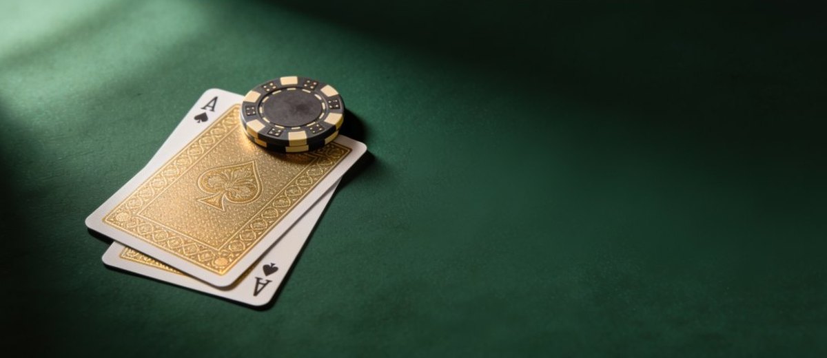 Blackjack and poker cards at a casino table