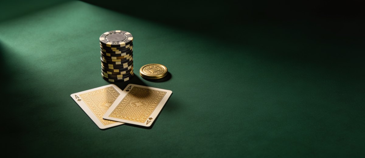 Poker cards, chips and a dealer button