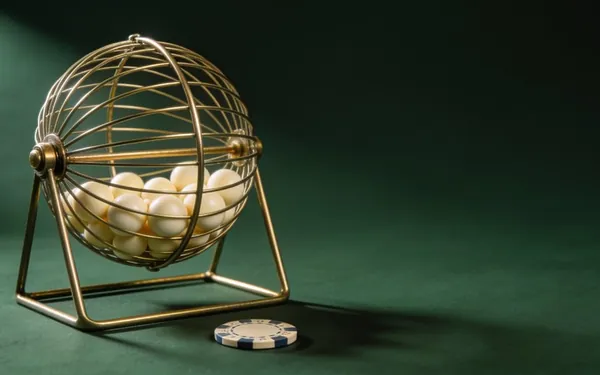 Brass bingo cage with numbered balls