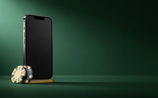 Smartphone standing next to casino chips