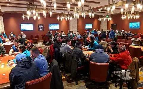 Players at a poker tournament in a casino card room